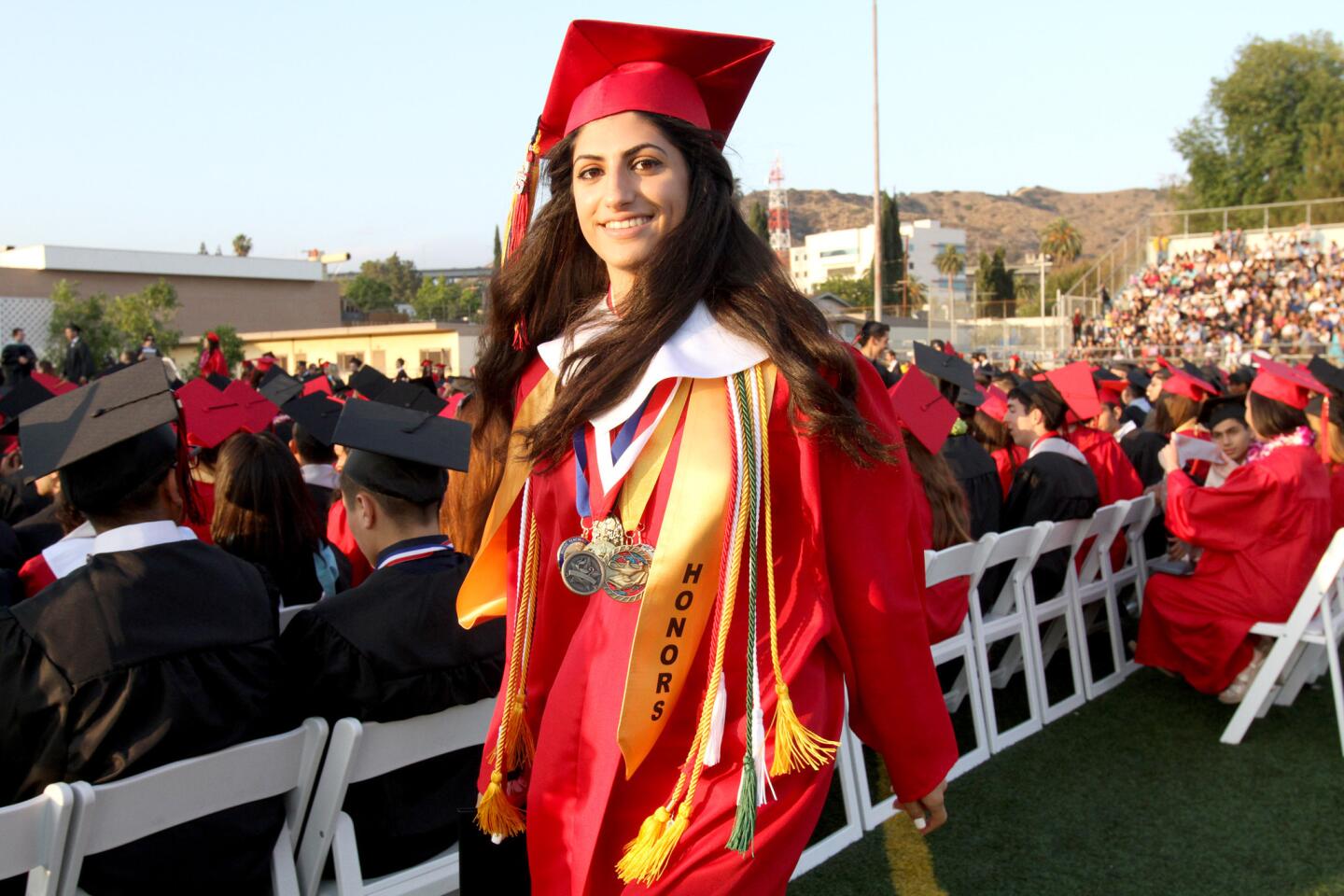 High School Student Graduates, As Her Hero Cheers Her on