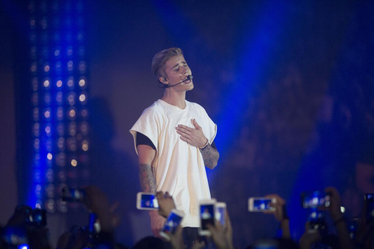 Justin Bieber performs at the Calvin Klein Jeans music event in Hong Kong.