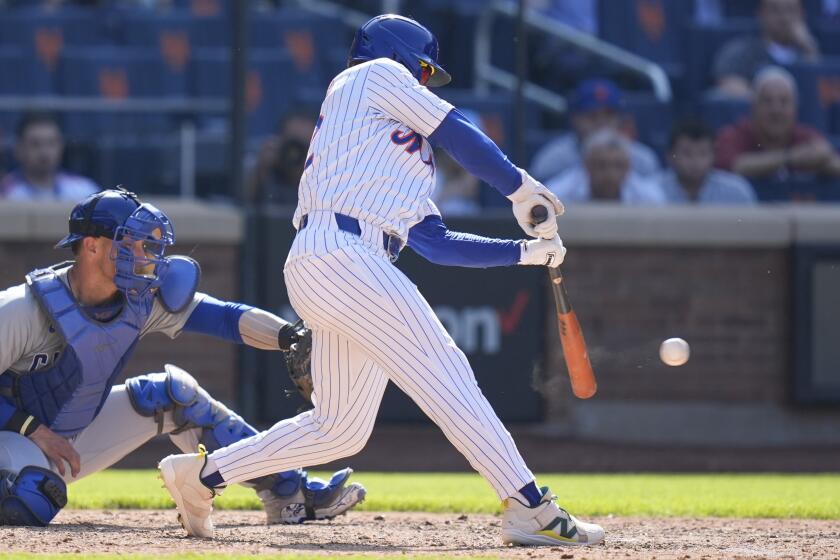 New York Mets' Francisco Lindor hits a walk-off two-run double during the 11th inning of a baseball game against the Chicago Cubs at Citi Field, Thursday, May 2, 2024, in New York. The Mets defeated the Cubs 7-6 in 11 innings. (AP Photo/Seth Wenig)