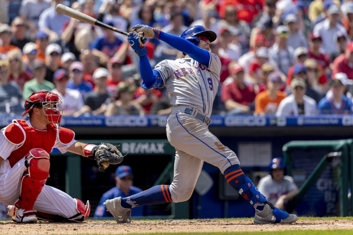 New York Mets' Brandon Nimmo (9) hits a home run during the third inning of a baseball game against the Philadelphia Phillies, Wednesday, April 13, 2022, in Philadelphia. (AP Photo/Laurence Kesterson)