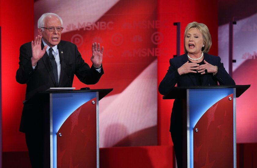 Former Sen. and Secretary of State Hillary Clinton and Sen. Bernie Sanders at a debate in Durham, N.H., that was hosted by MSNBC.