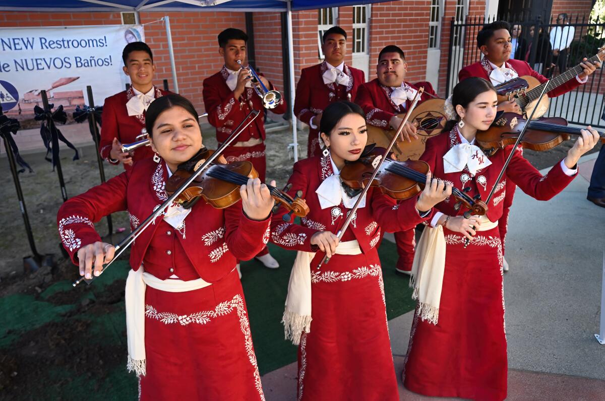 Members of a local mariachi band perform Sunday during a groundbreaking ceremony at Costa Mesa's Saint Joachim Church.