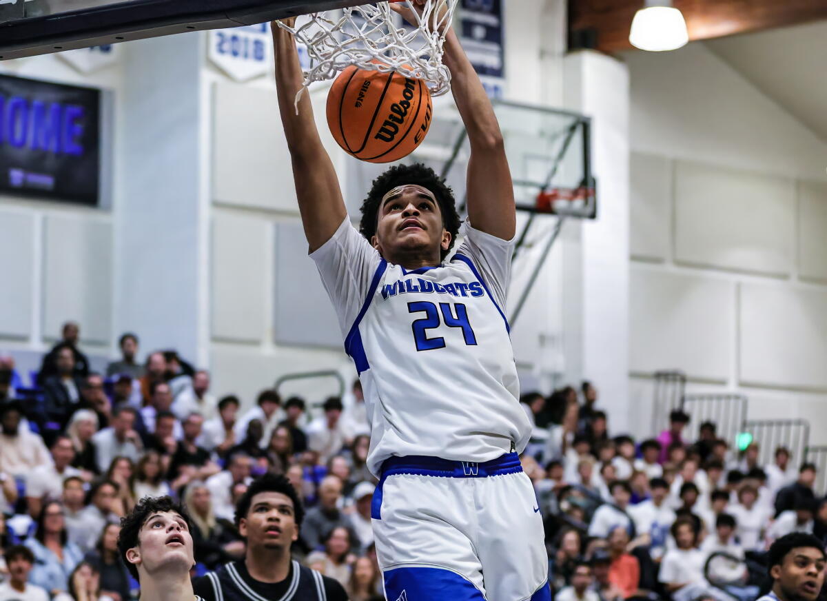 Davey Harris of Windward High scores on a two-handed dunk against Brentwood.