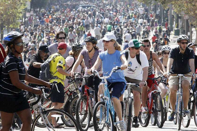 Thousands of bicyclists pedal up and down Spring Street in downtown Los Angeles during the fifth CicLAvia in October.