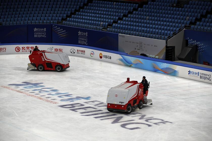 Zambonis resurface the ice skating rink at the Capital Indoor Stadium after a test event for the 2022 Beijing Winter Olympics in Beijing, Friday, April 2, 2021. The organizers of the 2022 Beijing Winter Olympics has started 10 days of testing for several sport events in five different indoor venues from April 1-10, becomes the first city to hold both the Winter and Summer Olympics. (AP Photo/Andy Wong)
