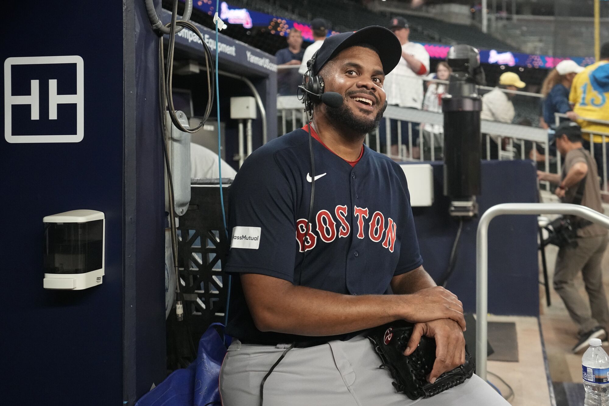 Kenley Jansen smiles as he does a radio interview after earning his 400th save on May 10, 2023, in Atlanta.