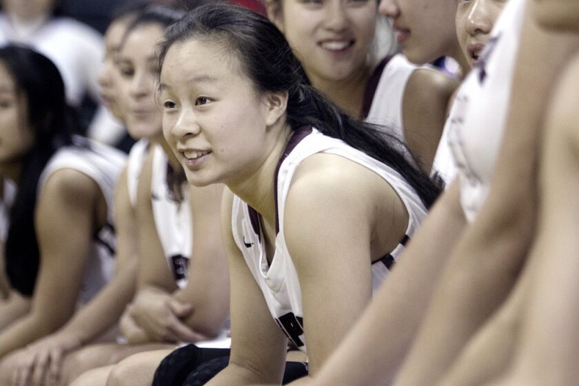 Mark Keppel High School's Lauren Saiki sits with her teammates after winning a game against Redondo Union at Cal State Long Beach on March 21. Mark Keppel won against Redondo Union 48-44 and their first CIF title ever. Saiki will be playing for Division 1 West Virginia University.