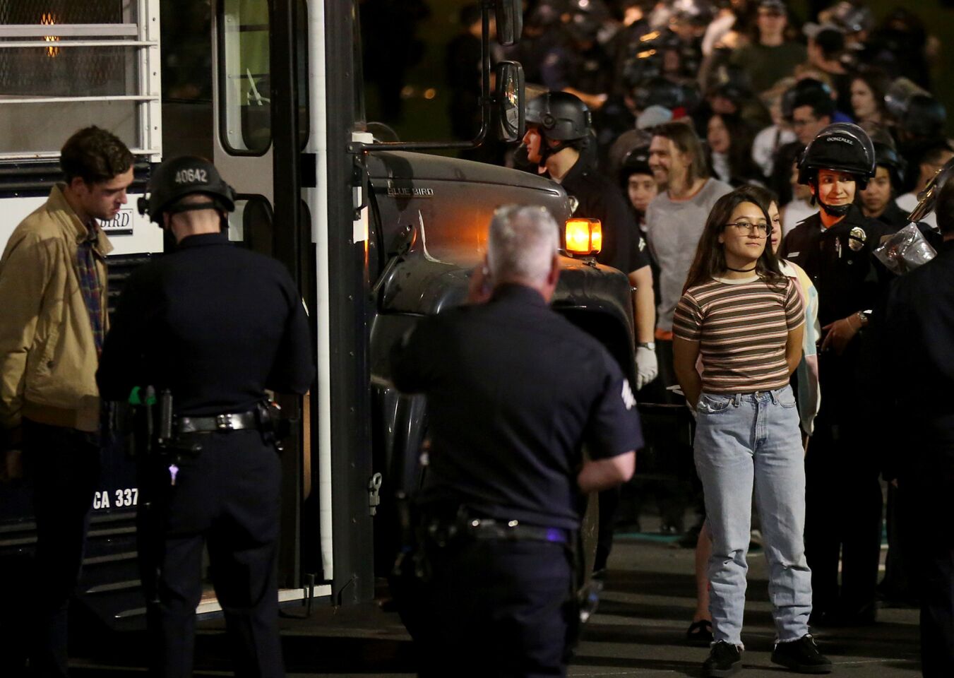 Police arrest about 150 anti-Trump protesters at Grand Park in downtown Los Angeles in Saturday's early morning hours.