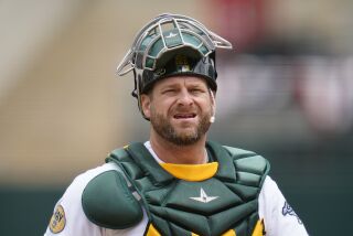 FILE - Oakland Athletics catcher Stephen Vogt walks on the field during a baseball game against the Toronto Blue Jays in Oakland, Calif., Wednesday, July 6, 2022. Vogt is retiring after 10 major league seasons and a long, patient road to break into the big leagues at age 27. (AP Photo/Godofredo A. Vásquez, File)