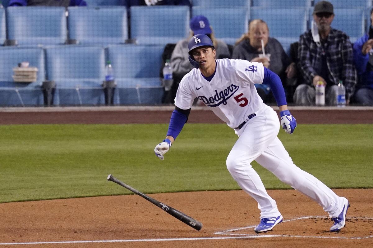 Dodgers shortstop Corey Seager drops his bat after hitting a solo home run.