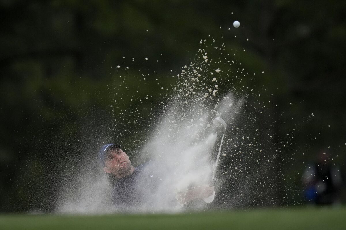 Scottie Scheffler hits out of a bunker on the 17th hole during the second round of the Masters.