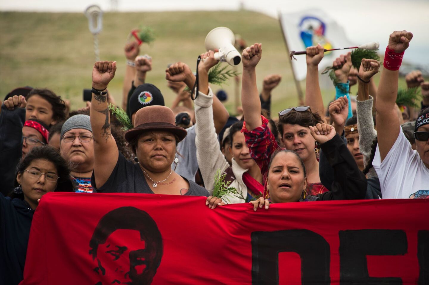 Native Americans march to a sacred burial ground site that was disturbed by bulldozers working on the Dakota Access Pipeline. Hundreds of people have gathered to join the Standing Rock Sioux tribe's protest of the oil pipeline that is slated to cross the Missouri River near Cannon Ball, N.D.