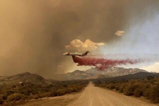 An air tanker making a fire retardant drop over the York fire in Mojave National Preserve on Saturday, July 29, 2023. 
