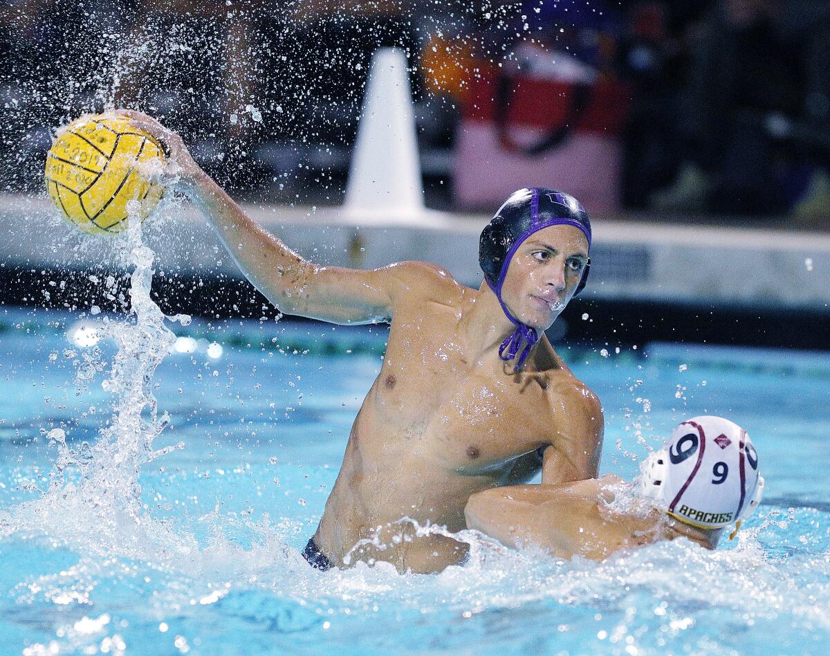 Hoover's Hakop Ansuryan rises before shooting against Arcadia's Daniel Oo in a Pacific League boys' water polo final at Arcadia High School on Thursday, October 31, 2019. Hoover won the Pacific League title beating Arcadia 10-6.