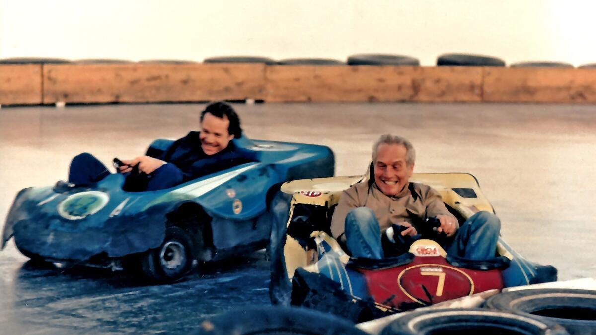 Paul Newman beats Michael Ovitz to the finish line at a slick track in Los Angeles.