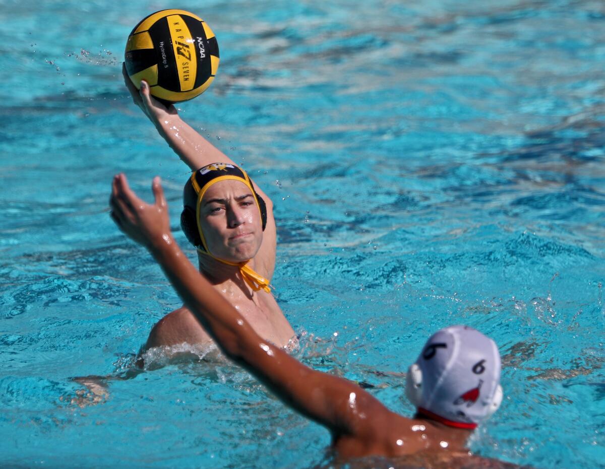 St. Francis High School water polo player Robert Alietti takes a shot on goal under pressure in CIF Southern Section Division V quarterfinal match vs. Burroughs High School at Notre Dame High School in Sherman Oaks on Saturday, Nov, 9, 2019. St. Francis won the match 9-8.
