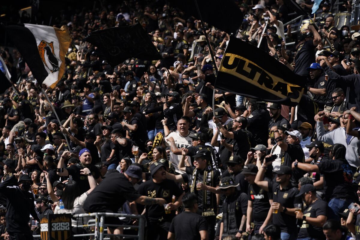 LAFC fans cheer before the team's match against the Colorado Rapids.