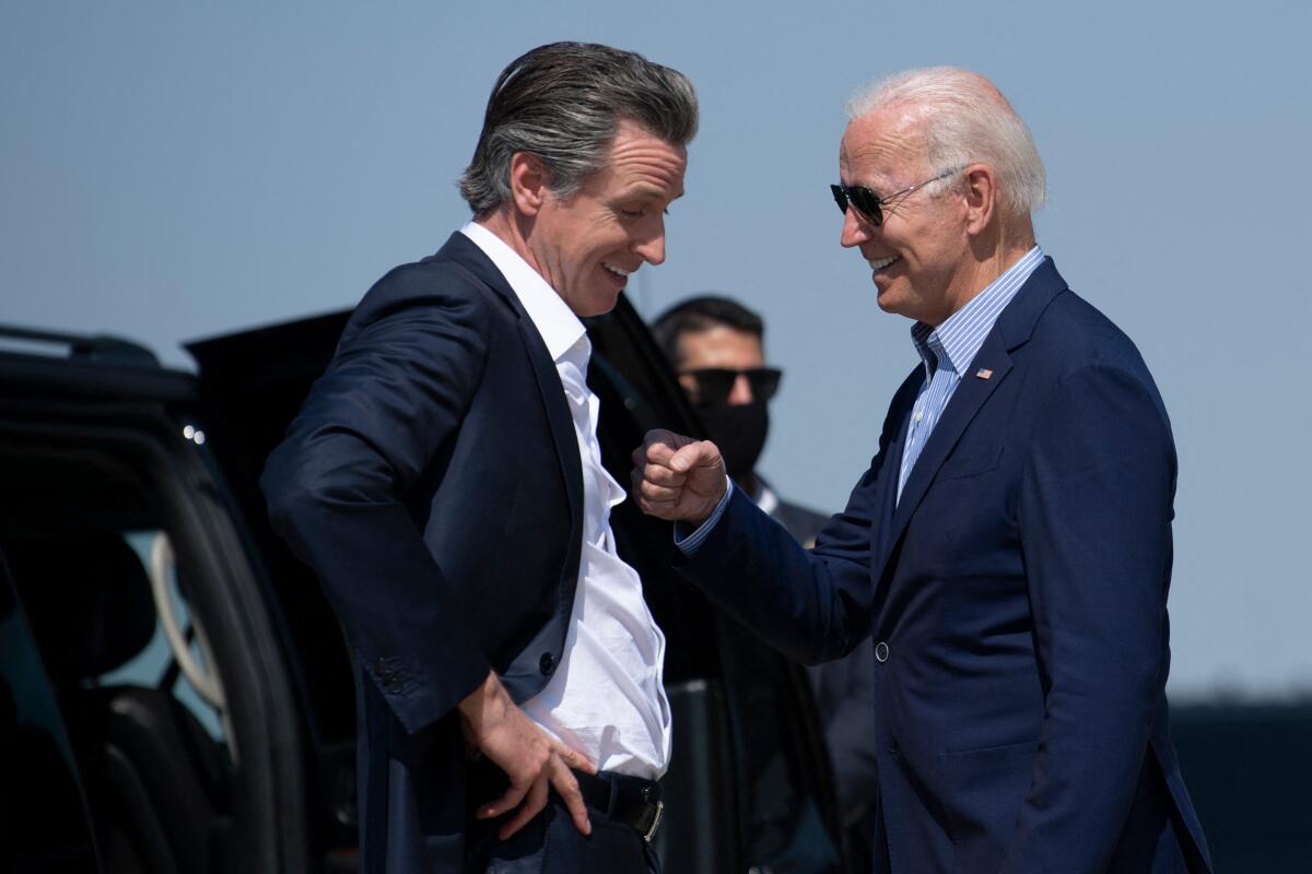 Gov. Gavin Newsom greets President Biden in Sacramento in 2021 during a visit to western states to discuss climate change. 