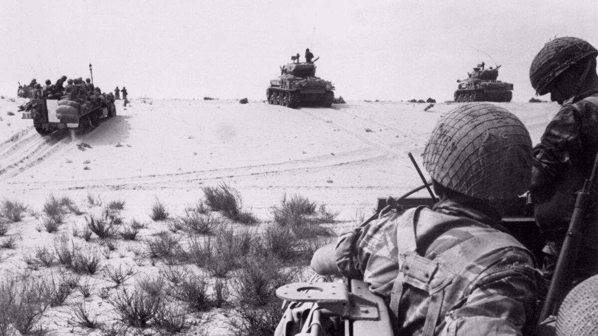 Israeli armored forces in action in the Sinai Desert on June 5, 1967.
