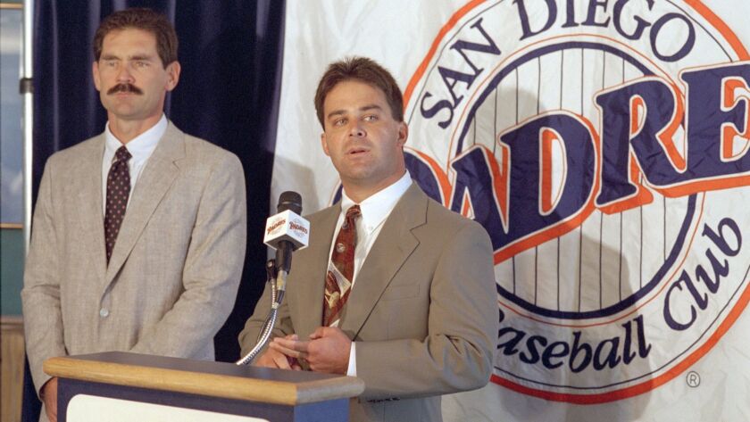 From October 1994, Padres General Manager Randy Smith (right) introduces the team's new manager, Bruce Bochy.