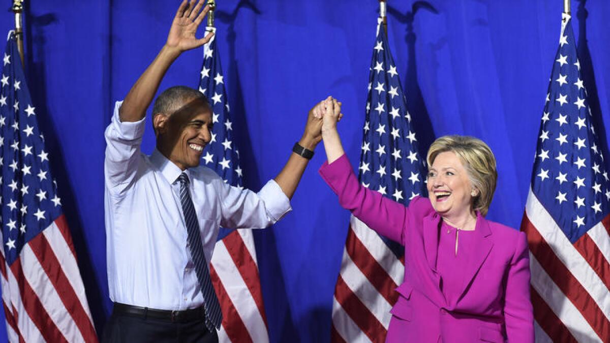 President Obama campaigns with Hillary Clinton in Charlotte, N.C., on Tuesday.