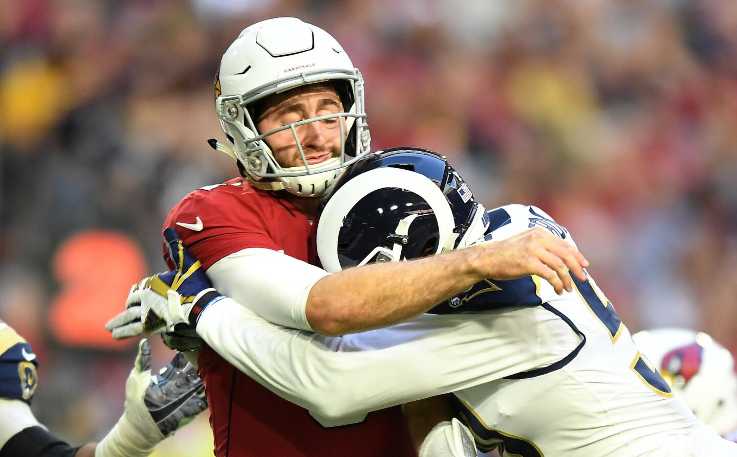 Rams linebacker Samson Ebukam is called for a roughing the passer penalty while hitting Arizona Cardinals qarterback Josh Rosen in the second quarter at State Farm Stadium on Sunday.