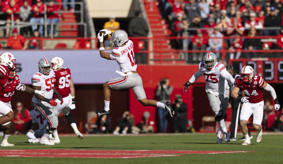 Ohio State wide receiver Jaxon Smith-Njigba (11) catches a pass against Nebraska during the first half of an NCAA college football game Saturday, Nov. 6, 2021, at Memorial Stadium in Lincoln, Neb. Ohio State defeated Nebraska 26-17. (AP Photo/Rebecca S. Gratz)