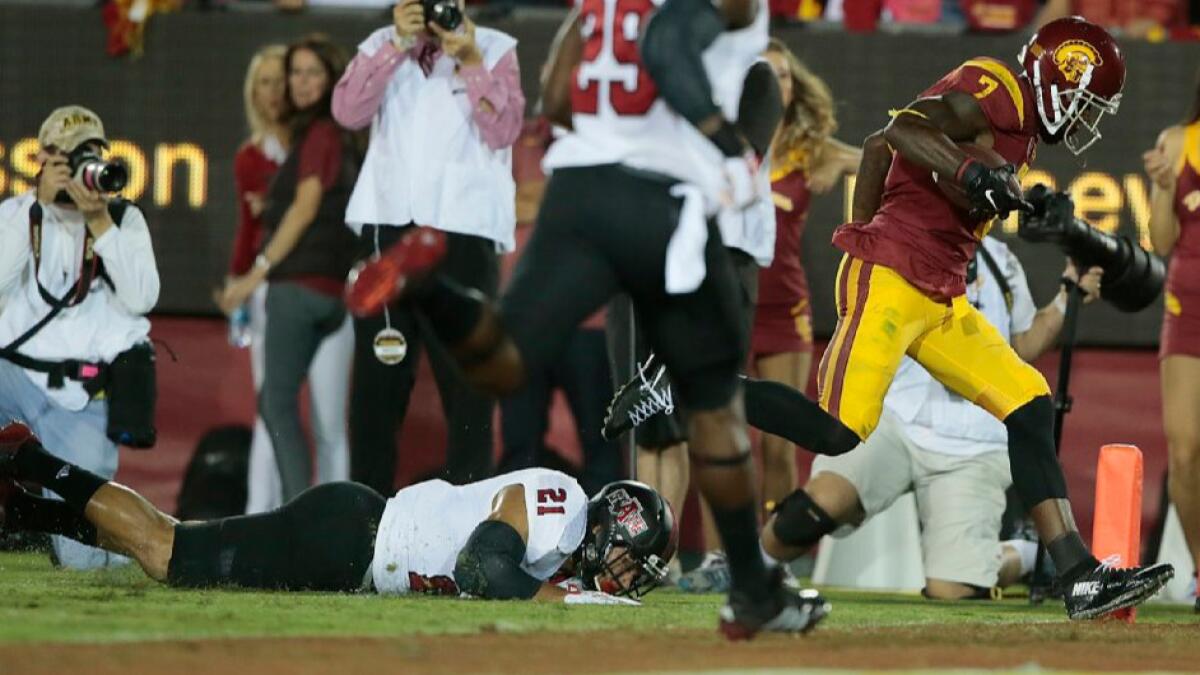 USC receiver Steven Mitchell leaves Arkansas State safety Cody Brown in the dirt as he scores during a game on Sept. 9.