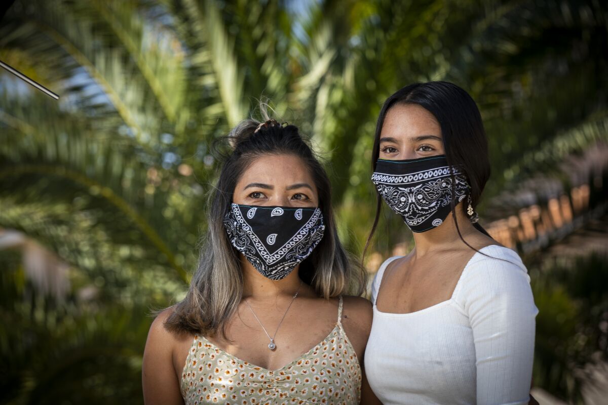 Donalene Ferrer, left, a Filipina, and her daughter, Charlie, 17.