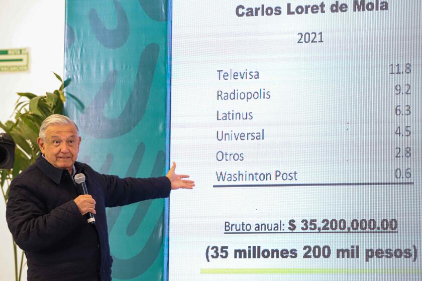 HERMOSILLO, MEXICO - FEBRUARY 11: President of Mexico Andres Manuel Lopez Obrador shows the annual income of journalist Carlos Loret de Mola a compared to his income as president during a press conference as part of a tour in Sonora at Military Base 18 on February 11, 2022 in Hermosillo, Mexico. (Photo by Luis Gutierrez Norte Photo/Getty Images)