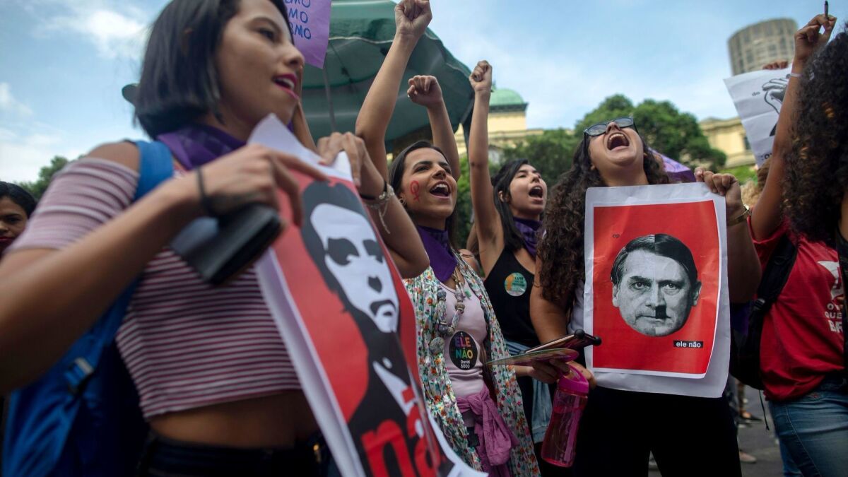 Women take part in a demonstration against Brazilian right-wing presidential candidate Jair Bolsonaro in Rio de Janeiro on Saturday.