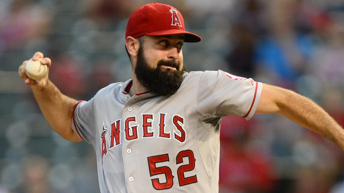 Angels starter Matt Shoemaker delivers a pitch against the Texas Rangers on Sept. 10. Shoemaker threw pitches at "full intensity" during his bullpen workout session Sunday.