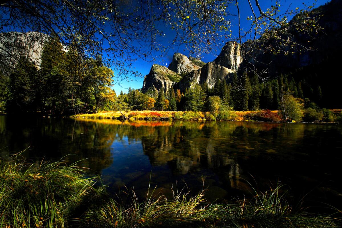 Bridalveil Fall looms over the Merced River in Yosemite National Park.