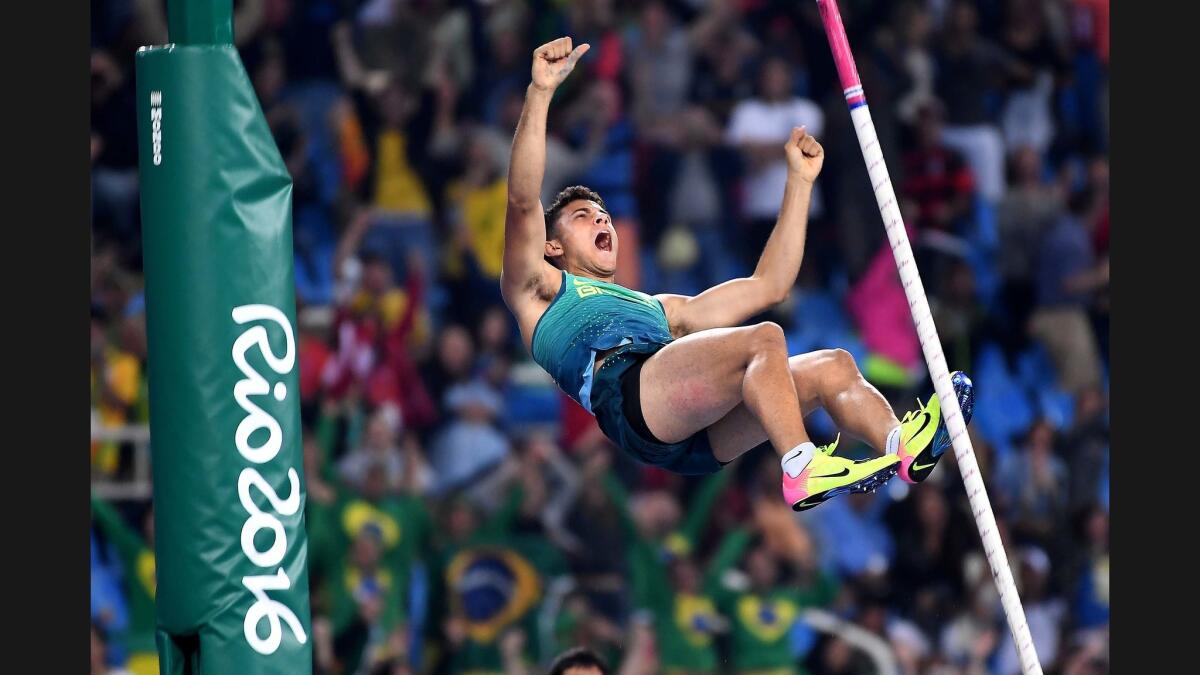 Brazil's Thiago Braz da Silva reacts after clinching the gold medal in pole vault with an Olympic-record 19-7 1/4.
