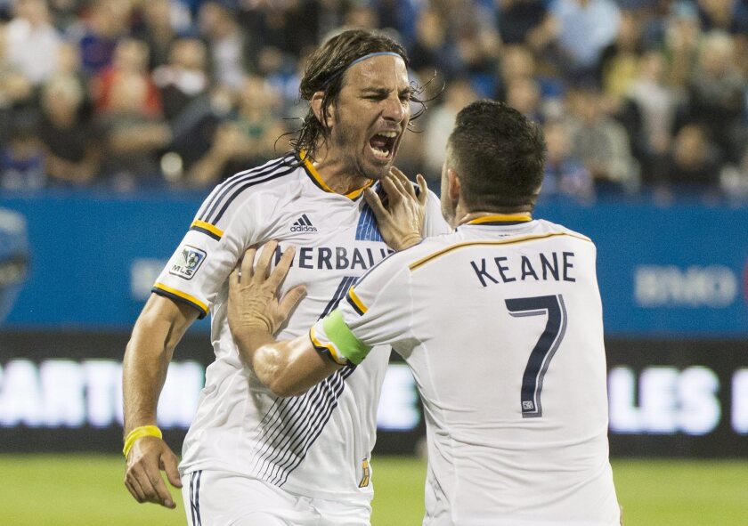 Alan Gordon, left, celebrates with Galaxy teammate Robbie Keane after scoring against the Montreal Impact on Sept. 10, 2014.