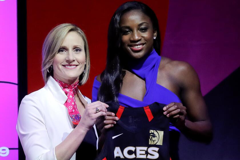 Notre Dame's Jackie Young, right, poses for a photo with WNBA COO Cristi Hedgpeth after being selected as the number one pick in the draft by the Las Vegas Aces in the WNBA basketball draft, Wednesday, April 10, 2019, in New York. (AP Photo/Julie Jacobson)