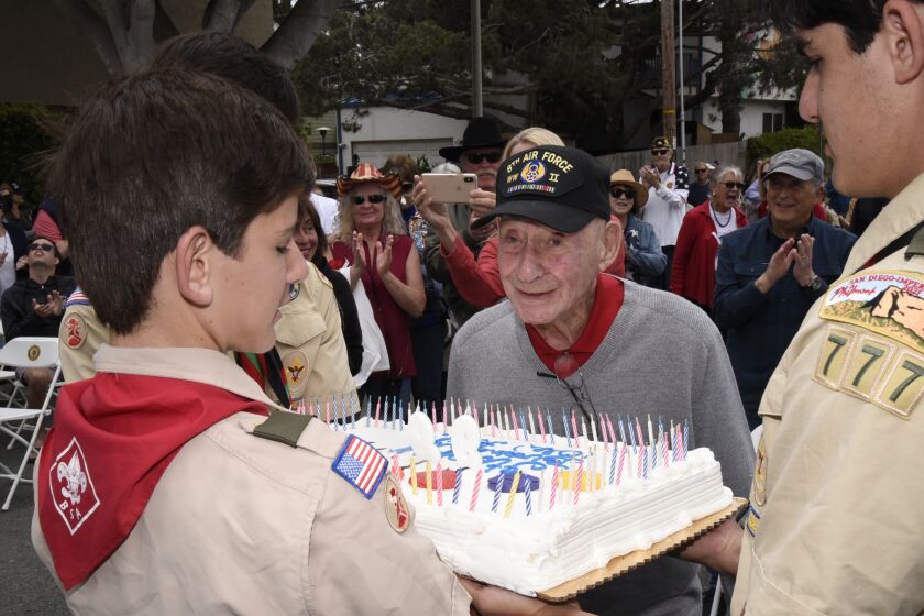 Boy Scouts presented 99-year-old WWII veteran Arthur Harris with a birthday cake