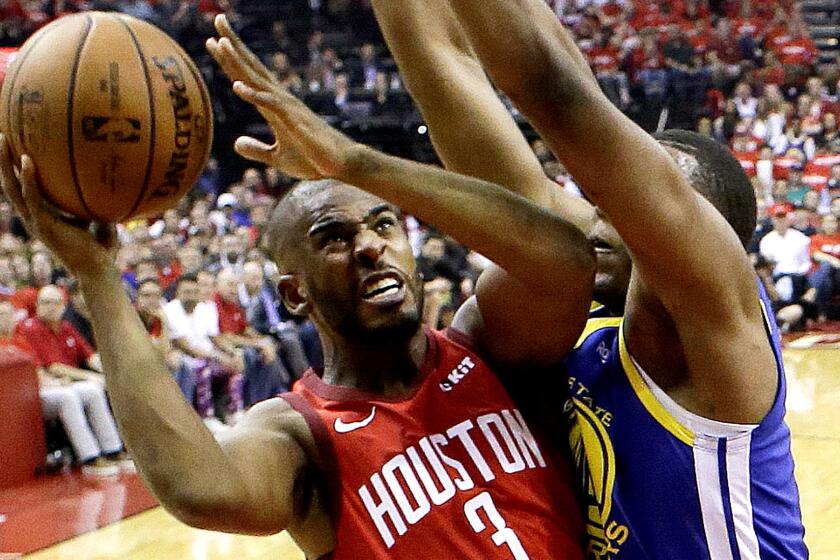 Houston Rockets guard Chris Paul (3) drives to the basket as Golden State Warriors center Kevon Looney defends during the first half of Game 3 of a second-round NBA basketball playoff series, Saturday, May 4, 2019, in Houston. (AP Photo/Eric Christian Smith)