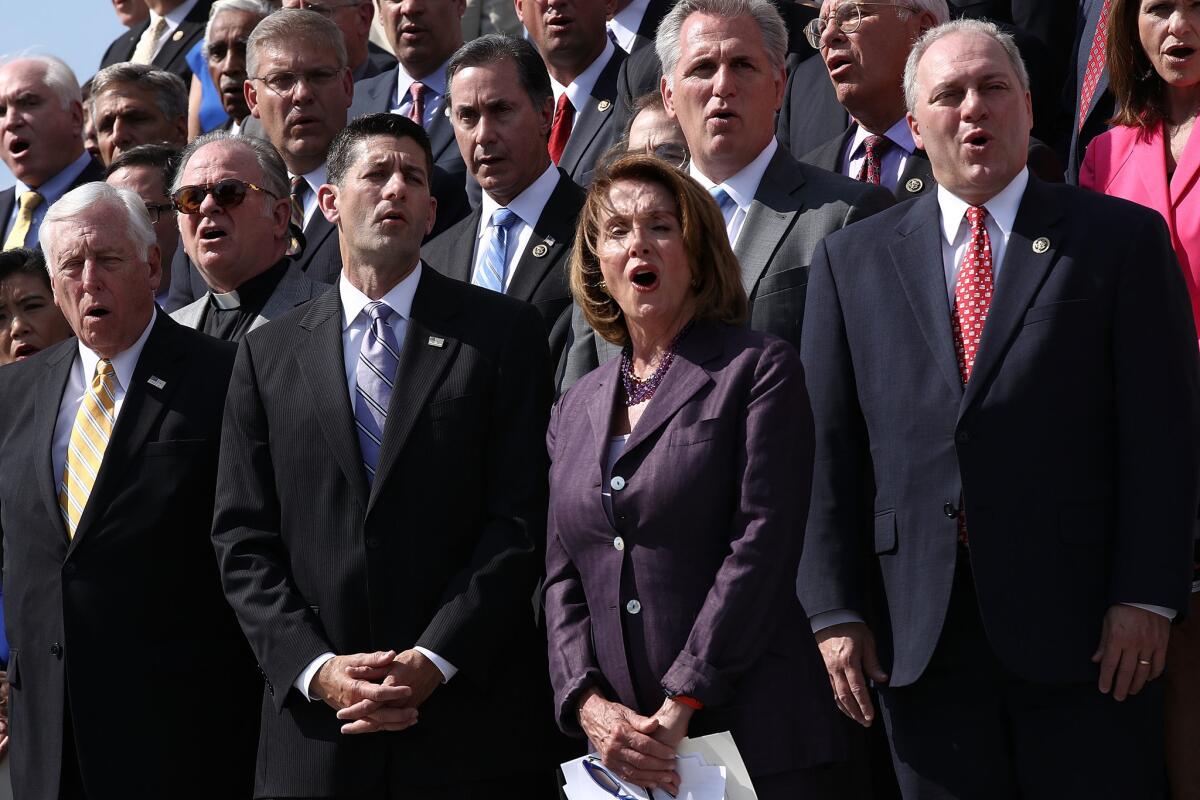 Speaker of the House Paul Ryan (R-WI) and House Minority Leader Nancy Pelosi (D-CA) join members of the House of Representatives in singing "God Bless America" on the steps of the U.S. Capitol.