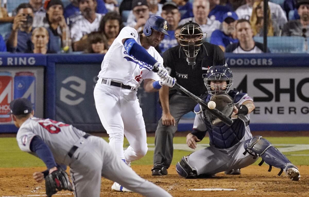 Joey Gallo hits a three-run home run for the Dodgers against Minnesota Twins relief pitcher Griffin Jax on Wednesday.