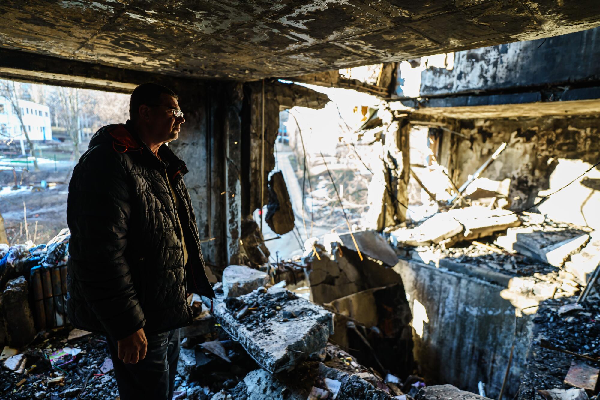 Damage inside a nine-story apartment building destroyed in Nemyshlianskyi.