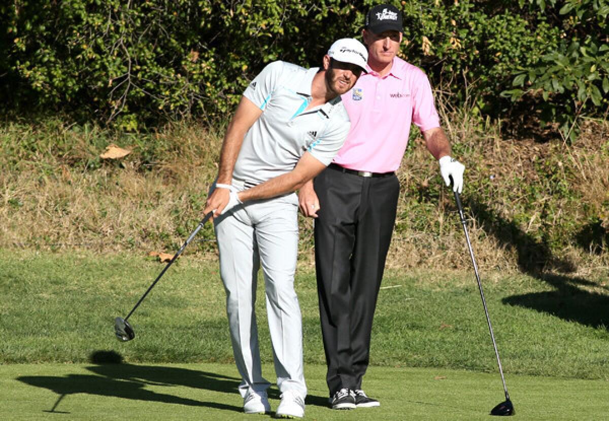 Dustin Johnson and Jim Furyk watch Johnson's tee shot at No. 13 on Friday during the second round of the Northern Trust Open at Riviera Country Club.