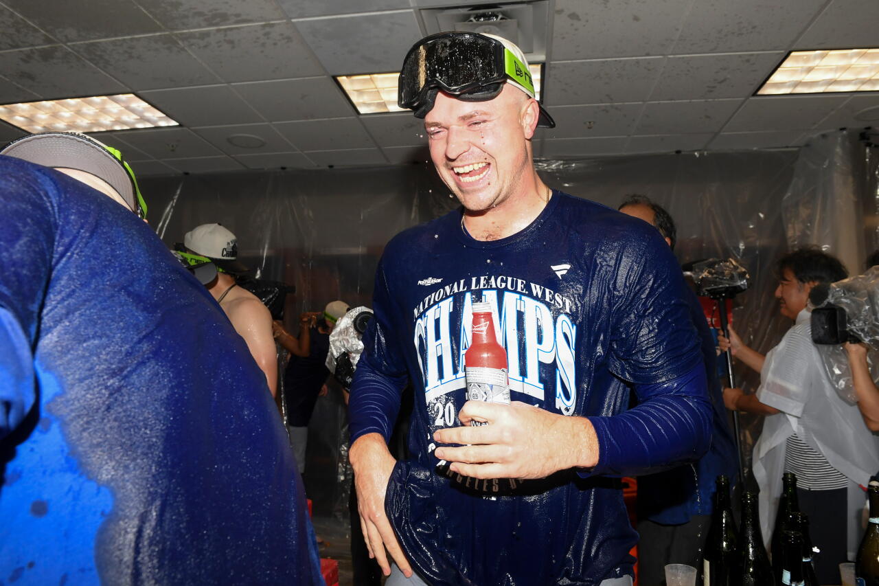 Tarik Skubal celebrates in the locker room after the Dodgers clinched the NL West title.