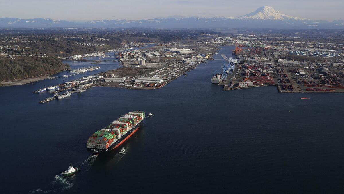 A cargo ship arrives at the Port of Tacoma in Washington in March.