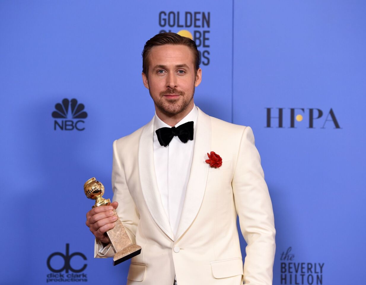 Ryan Gosling with his award for actor in a musical or comedy for his role in "La La Land."