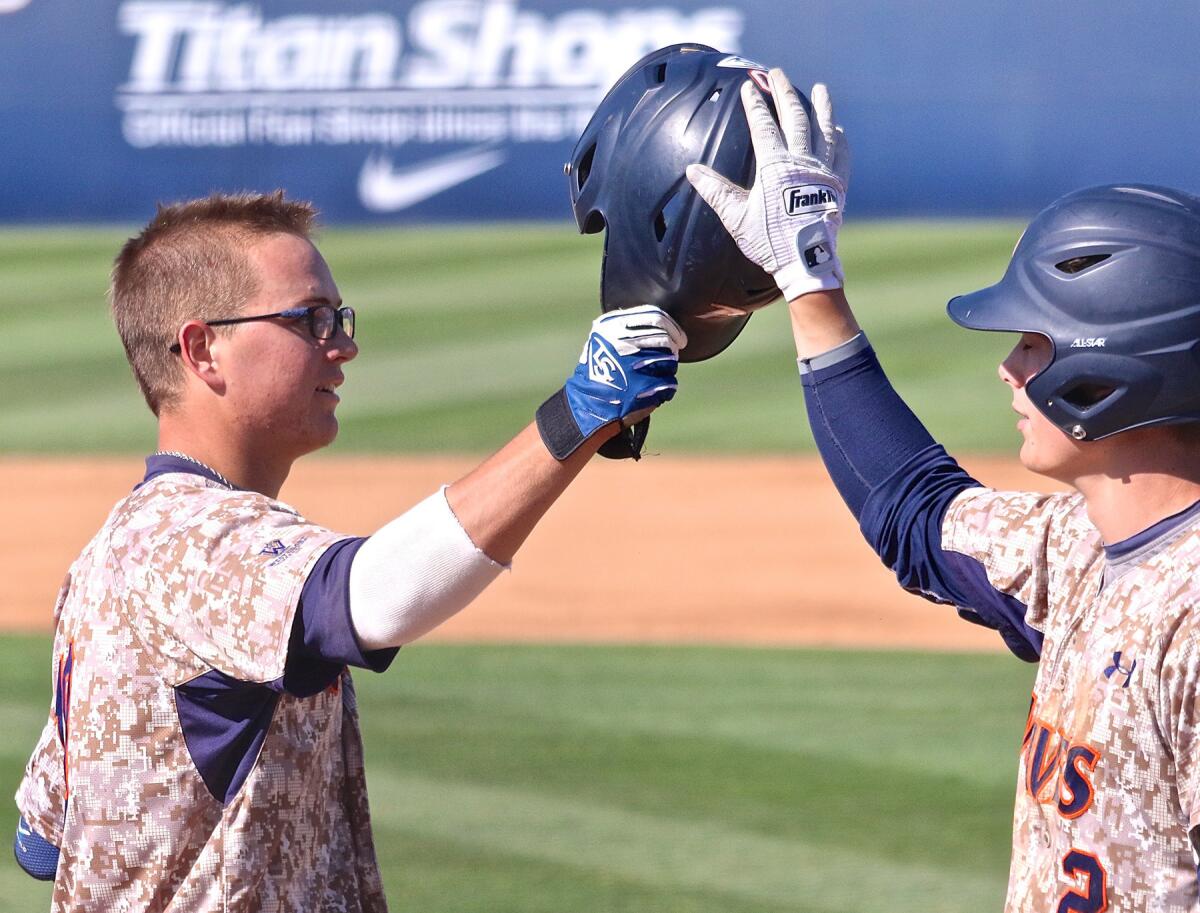 Pepperdine third baseman Chris Fornaci is congratulated after hitting a home run Saturday against Clemson in an elimination game of the NCAA tournament.