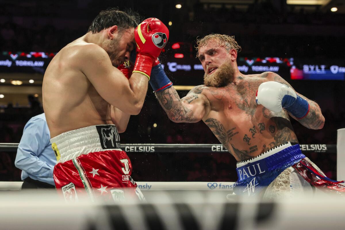 Jake Paul punches Julio César Chávez Jr. during their cruiserweight boxing match on Saturday at the Honda Center.