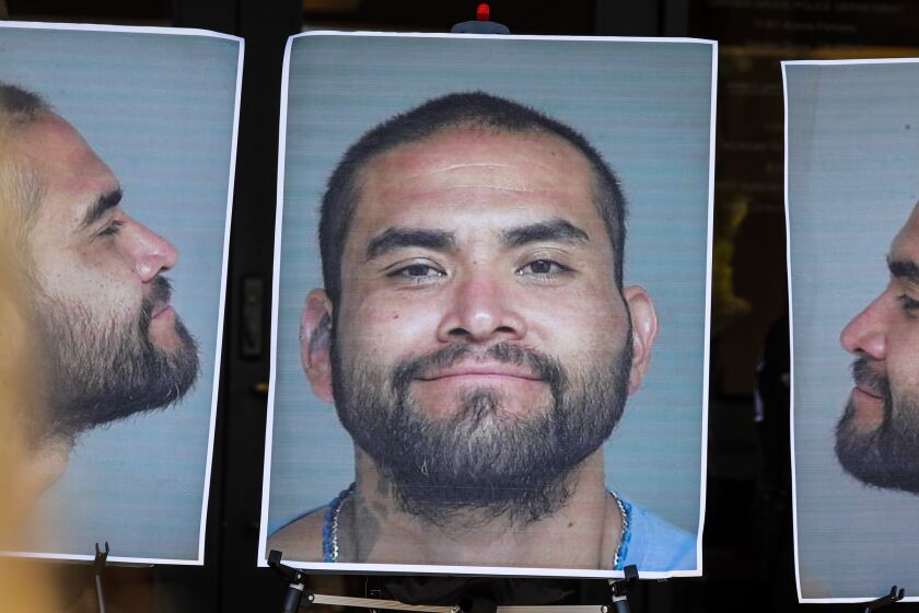 GARDEN GROVE, CA - AUGUST 08, 2019 Ñ Photos of suspect stabbing Zachary Castaneda displayed at the press conference at Garden Grove police headquarters. (Irfan Khan/Los Angeles Times)