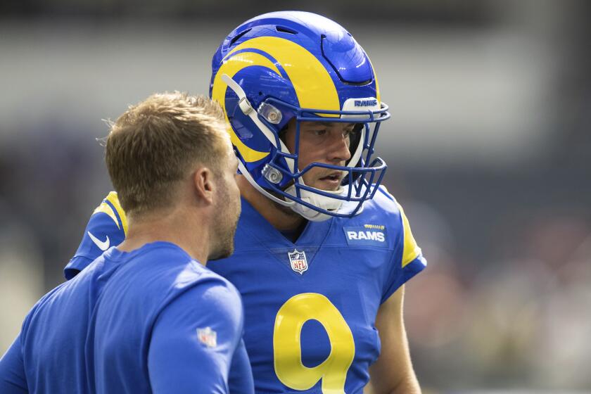 Los Angeles Rams quarterback Matthew Stafford (9) talks to Los Angeles Rams head coach Sean McVay.