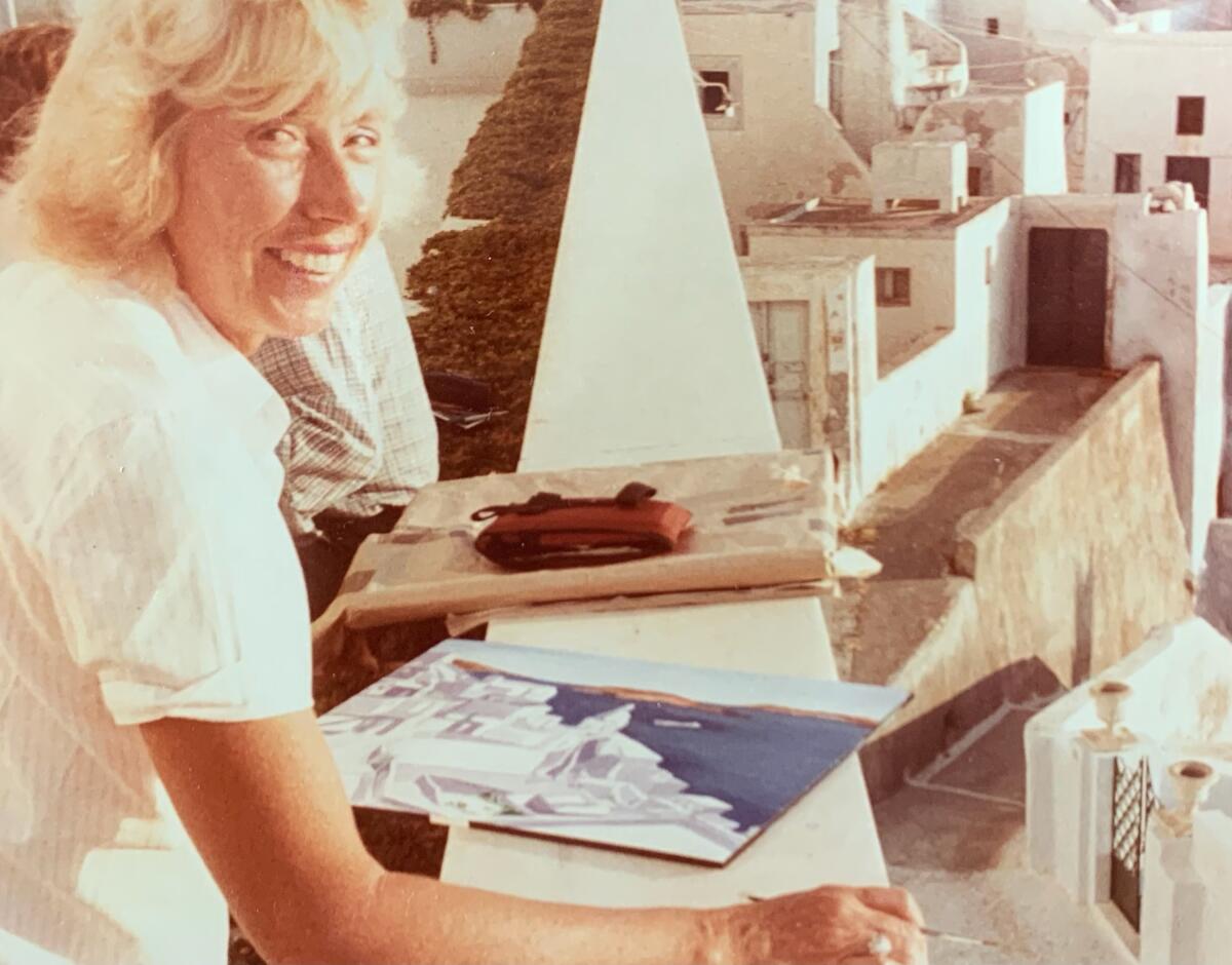 Mary Little paints a seascape of Greece while on a family vacation in this undated photo.